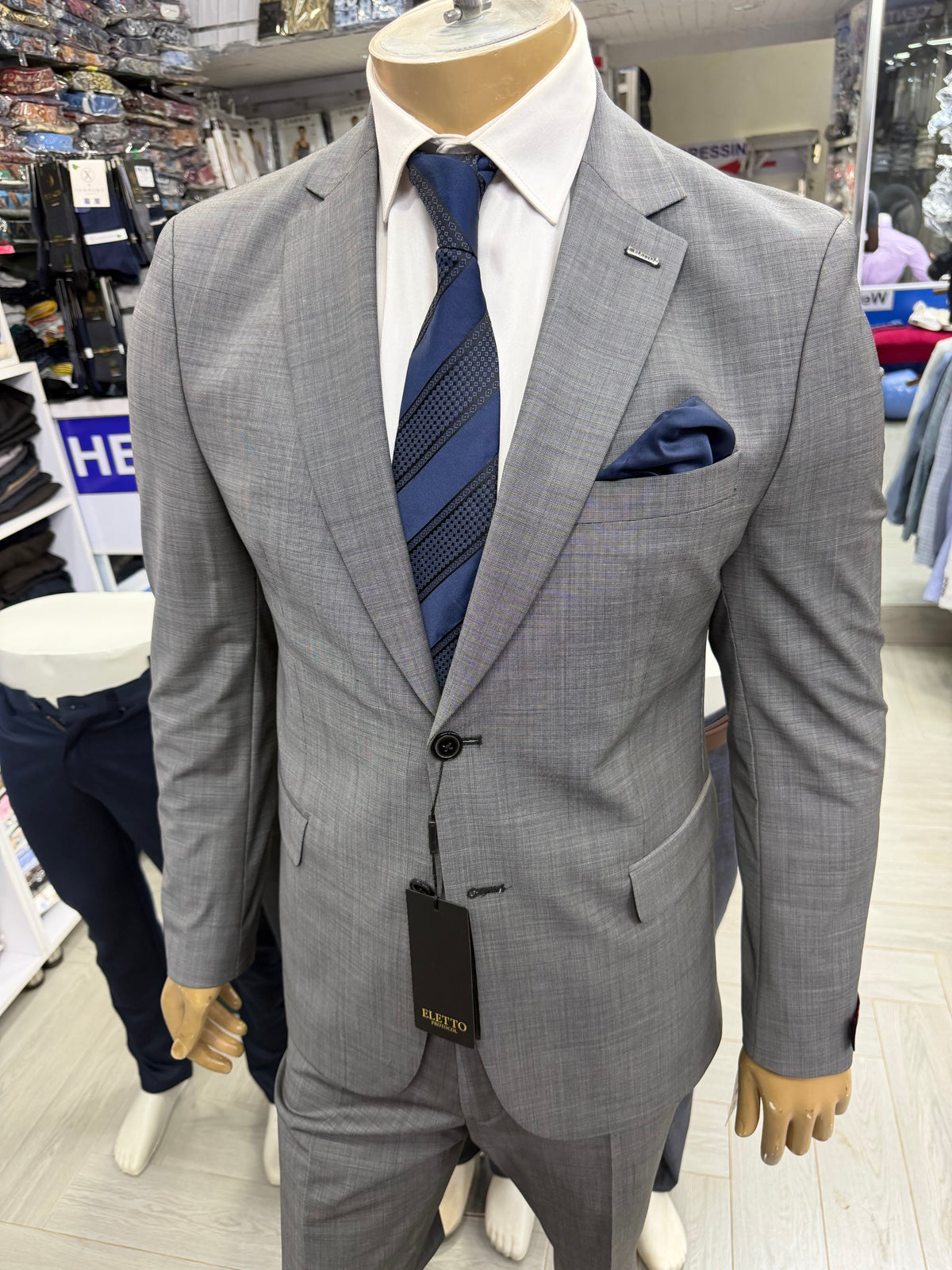 Grey woolen suits without shirt and tie